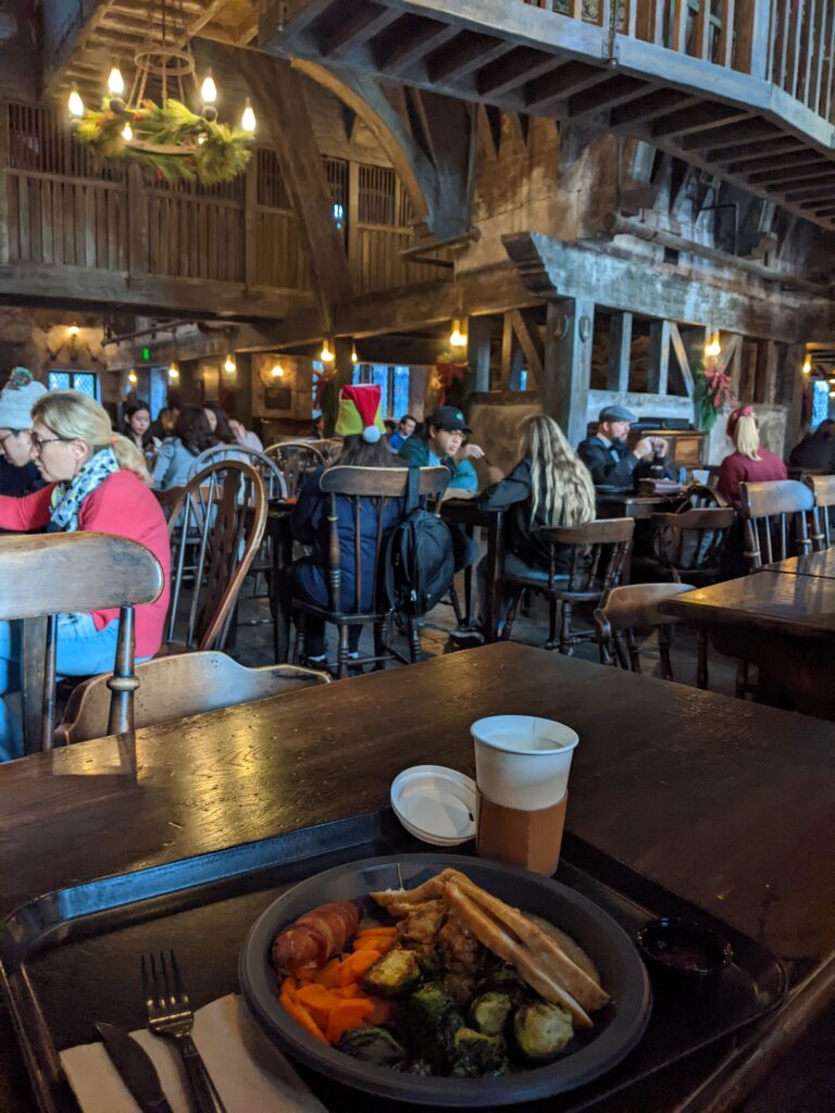 Eating a delicious Three Broomsticks holiday feast and hot butterbeer at the Wizarding World in Universal Studios Hollywood