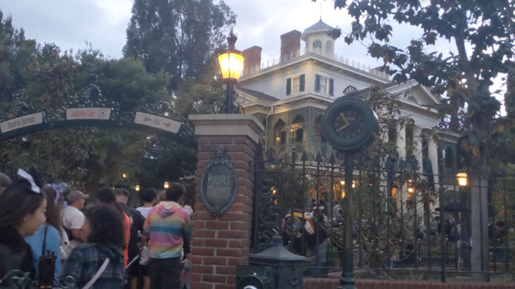Ride the Haunted Mansion dark ride at Disneyland